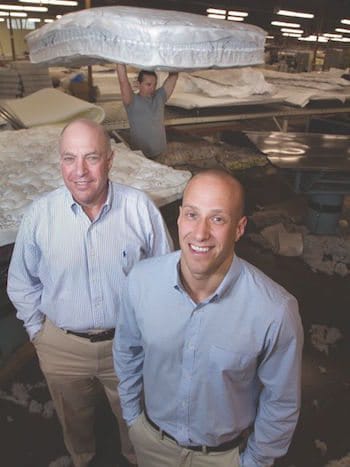 Gold Bond's Bob and Skip Naboicheck inside the mattress manufacturing plant