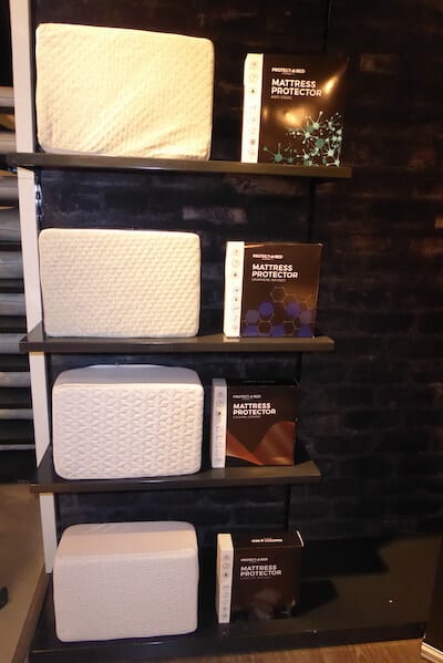 Surefit mattress protectors in a display case