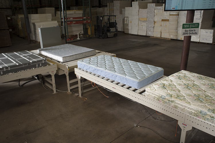 Finished mattresses are ready to go to the automatic bagger, then rolled and compressed.
