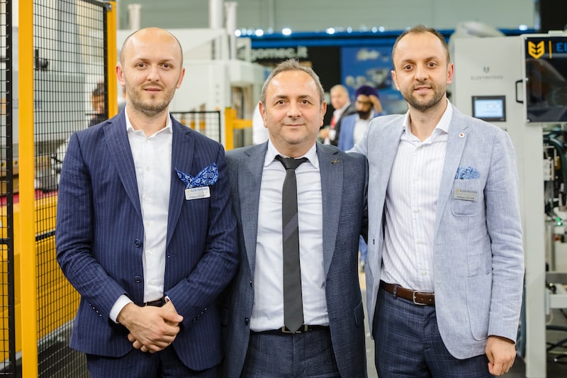 Elektroteks Co.’s founder Osman Güler, center, with his sons, Orhan, left, and Serkan, showed the company’s equipment at Interzum Cologne in Cologne, Germany, in 2019.