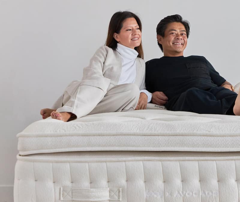 Vy Nguyen, co-chief executive officer of Avocado Green Brands, and his wife, Marcia, relax on a Goop X Avocado mattress, offered in a partnership with Gwyneth Paltrow’s Goop lifestyle brand.