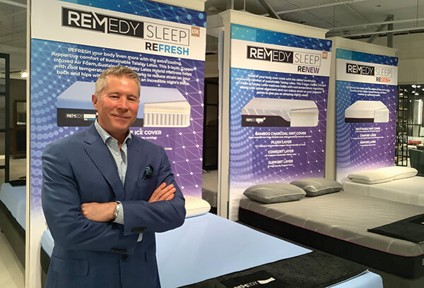 Marty Melcher stands with key beds in Legends’ Remedy Sleep line.
