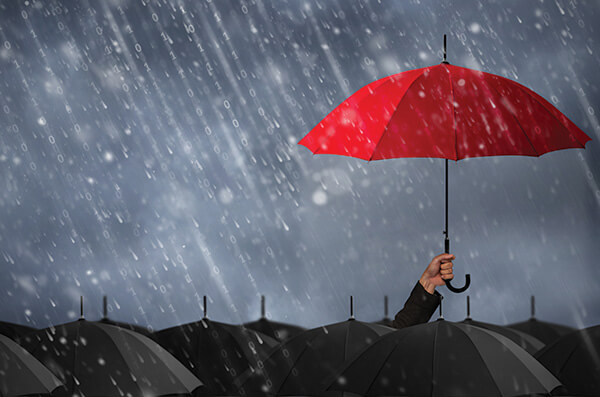 Red umbrella in a dark, rainy sky.