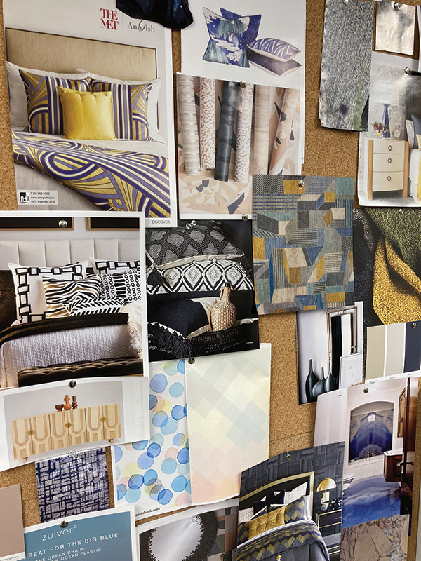 The Creative design team adds to a mood board in the design studio for inspiration.