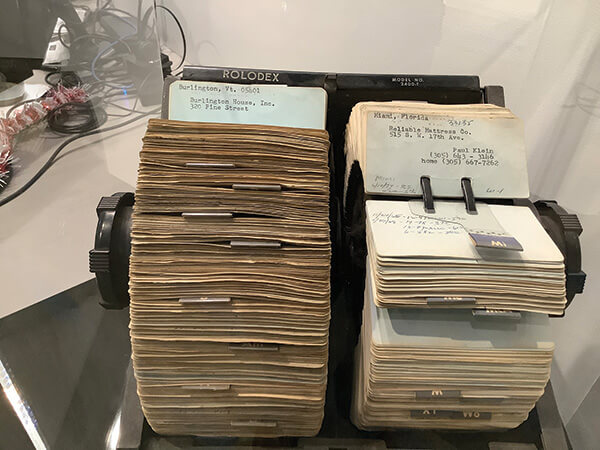 The Rolodex of Hy Weintraub, founder and chairman of Mantua Manufacturing Co., is displayed in a case at Rize Home’s headquarters.