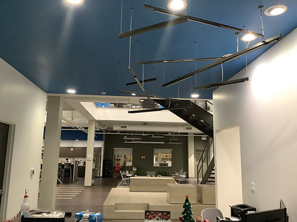 Bed frames, a signature product for Rize Home, are featured in this overhead display in Rize Home’s Cleveland offices.