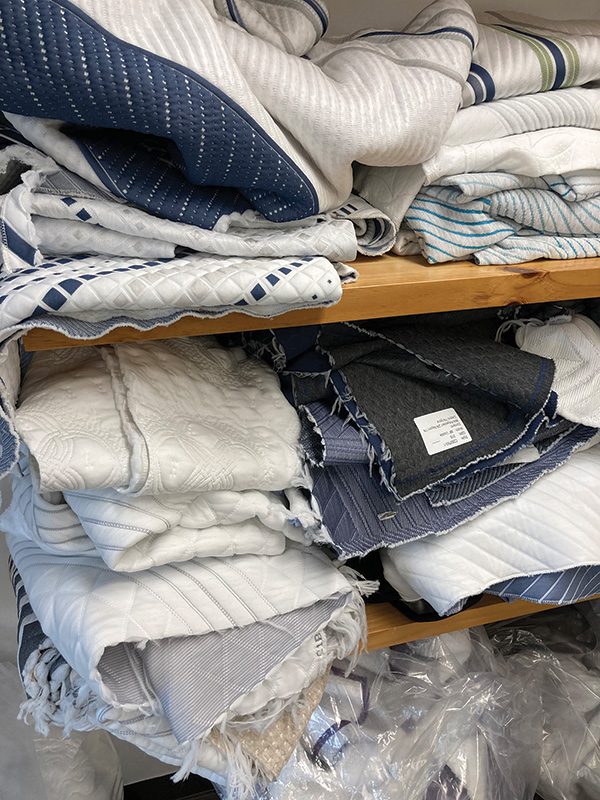 The new design studio at Creative is filled with samples of fabrics showing the trend toward touches of blues and grays.