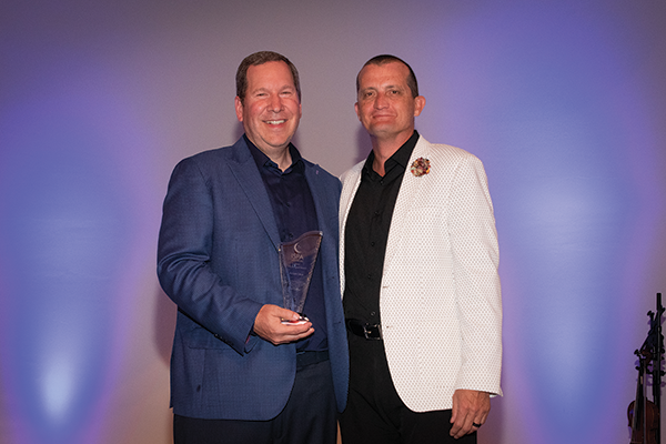 Adam Lava, director of sales for A Lava, took home the ISPA Vanguard Award. The new award recognizes individuals who offer forward-thinking solutions to challenges in the bedding industry and persist in making those solutions a reality. Lava, left, is standing with Jimmy Fleming, who introduced the award.