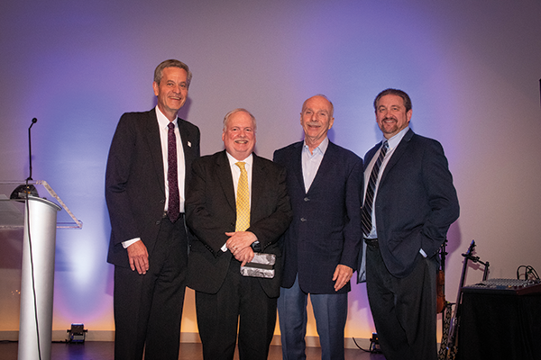 ISPA honored Dave Perry, second from left, for his 40 years covering the industry. He is flanked by ISPA President Ryan Trainer, Gary Fazio and Mark Hobson. 