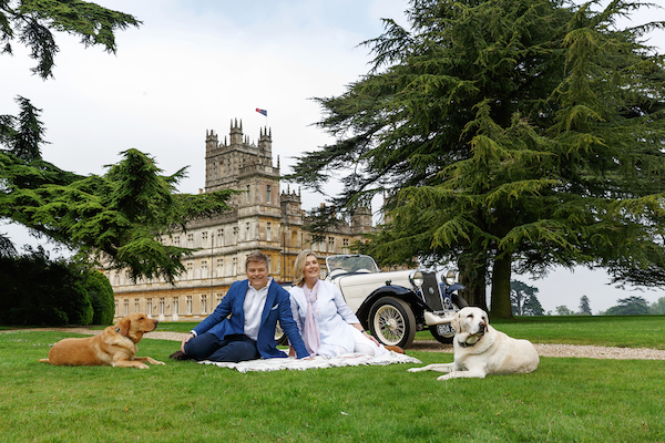 Lord and Lady Carnarvon enjoying a car picnic on the grounds of Highclere Castle.