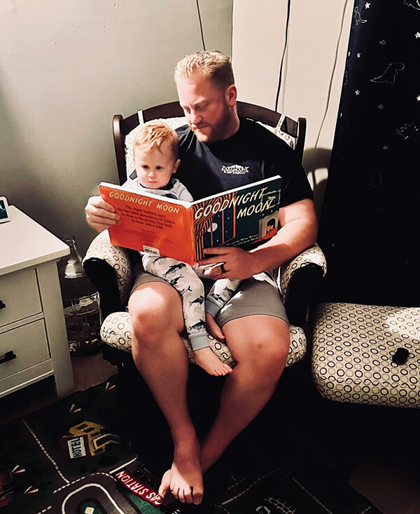 Steve Maddox reading to son Beau.