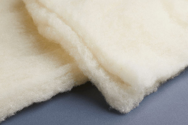 Joma Wool Batting is a nonwoven, layered, 100% wool batt designed for use in the top layer of a mattress
and/or the quilt of a mattress cover, as well as in futons and sofas.
