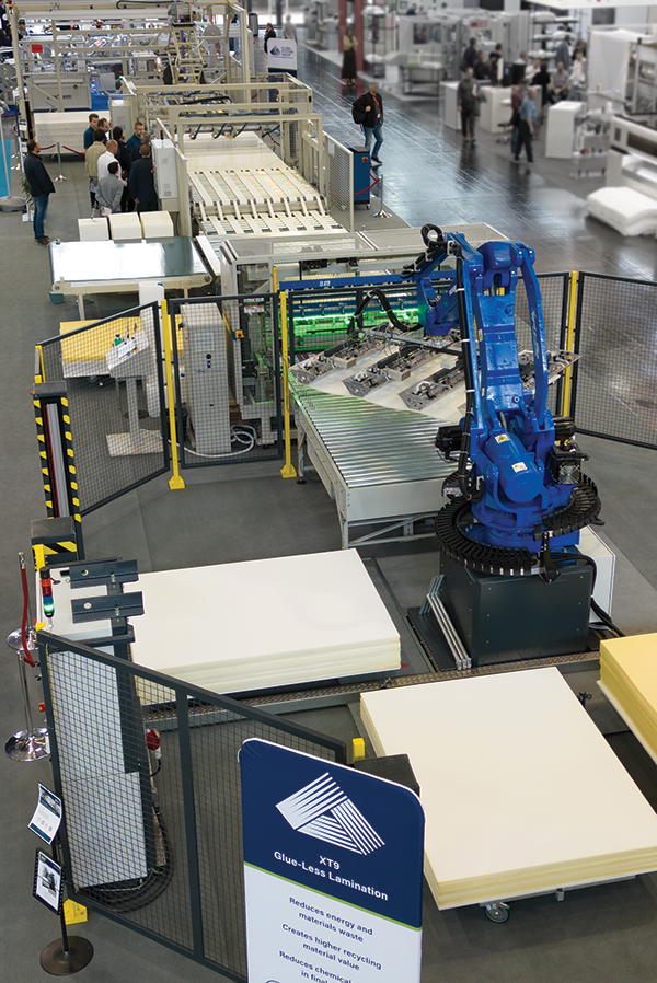 A portion of Global Systems Group’s space at Interzum Cologne showcased an automated production line, which included the XT9 loading robot seen here. 