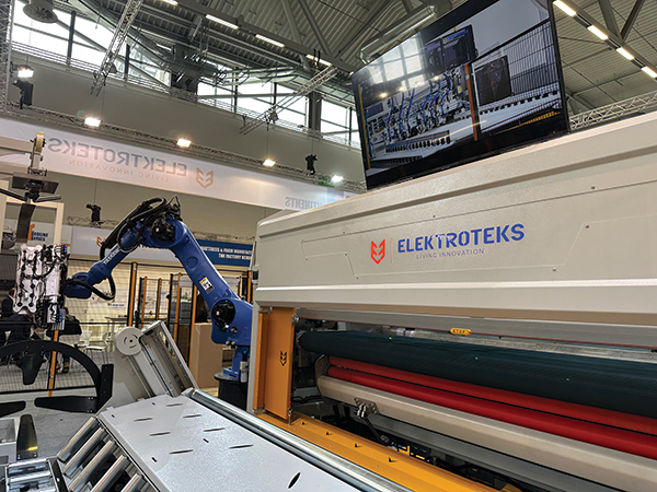 Elektroteks brought a number of its material handling machines, such as the robot arm in the background, to Interzum Cologne in May.