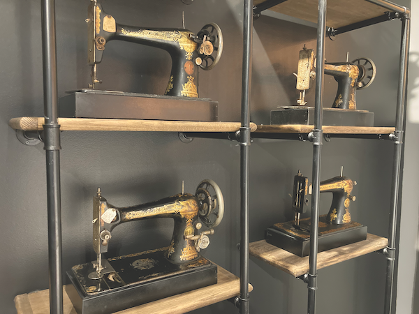 These antique sewing machines in the Las Vegas showroom window reflect the history of Kingsdown, established in 1904.
