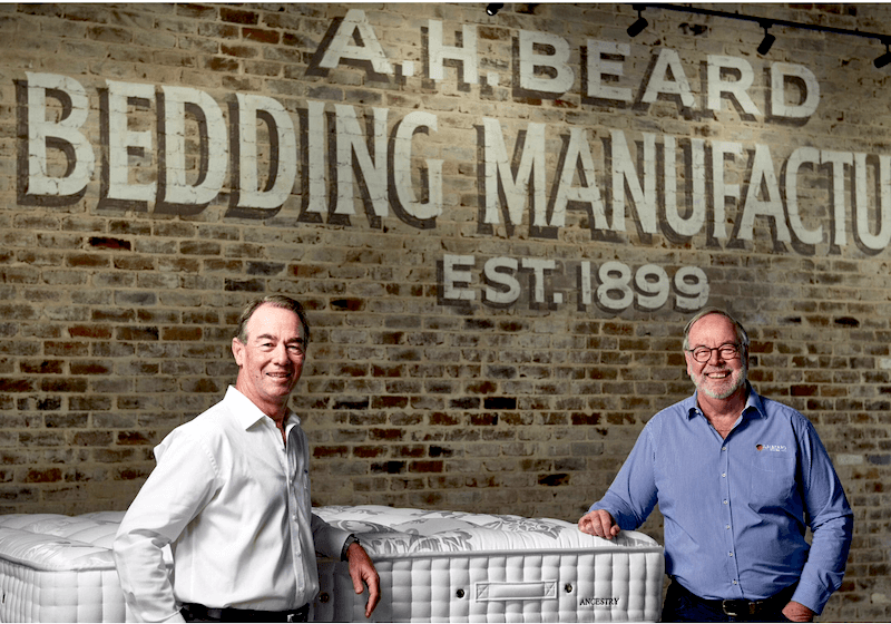 Allyn Beard (left), director of A.H. Beard, and his brother, Garry Beard, company chair, are the fourth generation of Beard family members to lead the bedding producer.