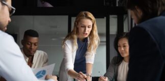 Discover the Top Reasons for Premium Mattress Sales Young businesswoman explaining research results in graphs to colleagues.