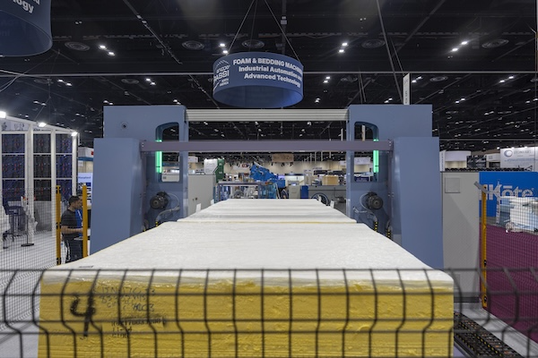 automated robotic arm in a mattress factory