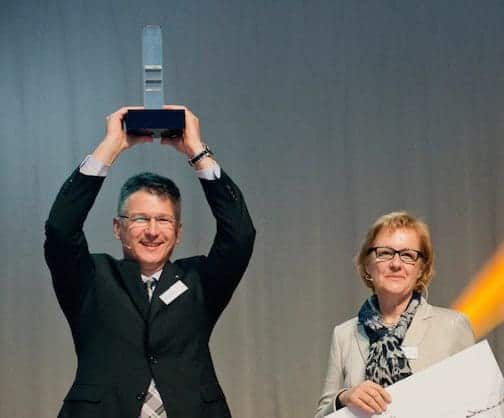 Alfa Klebstoffe owners show off sustainability award from Zürcher Kantonalbank
