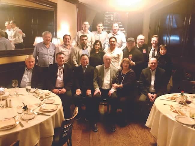 A group of Englander’s international licensees gathered with U.S.-based brand executives, including former Chief Executive Officer Kevin Toman (front row, fourth from left) and President Mark Kinsley (second row, second from right), during the Las Vegas Market in January. 