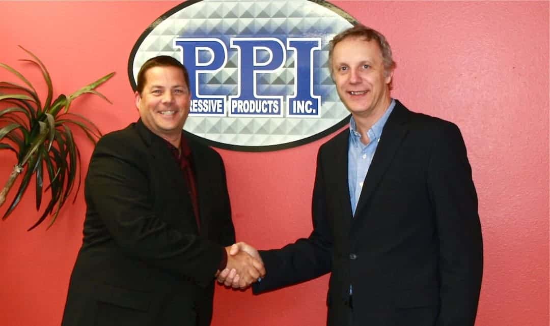 Todd Schmidt and Dirk Vandeplancke shake hands on PPI deal