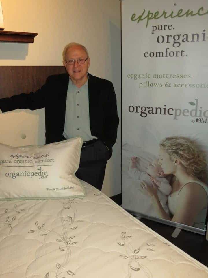 OMI's Walt Bader with a new bed in the Certified Organic Mattress collection.