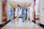 medics running down hospital corridor