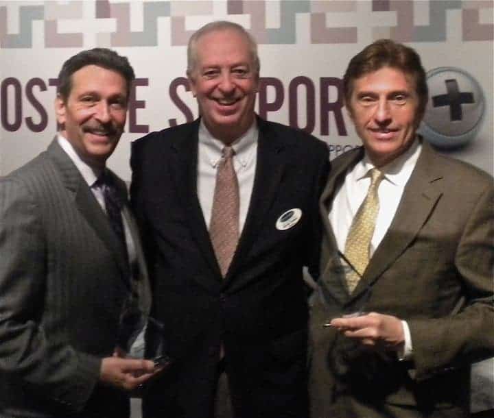 Kevin Toman, Englander president and CEO (center), presents 2013 performance awards  to Dominic Azevedo, president and CEO of Englander Southeast (left), and Ed Ciolkosz, owner and president of Englander Midwest.